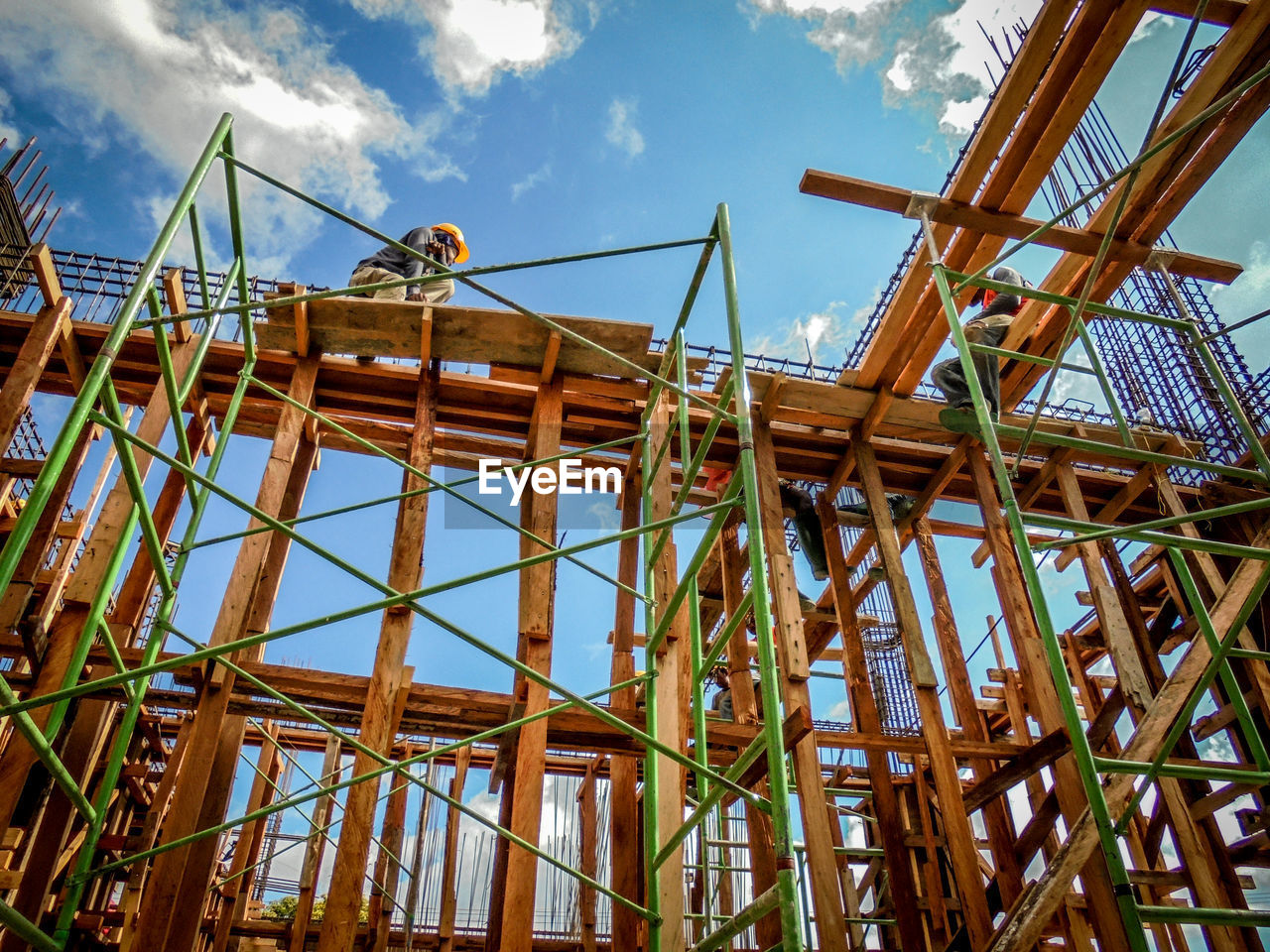 Low angle view of construction site against sky