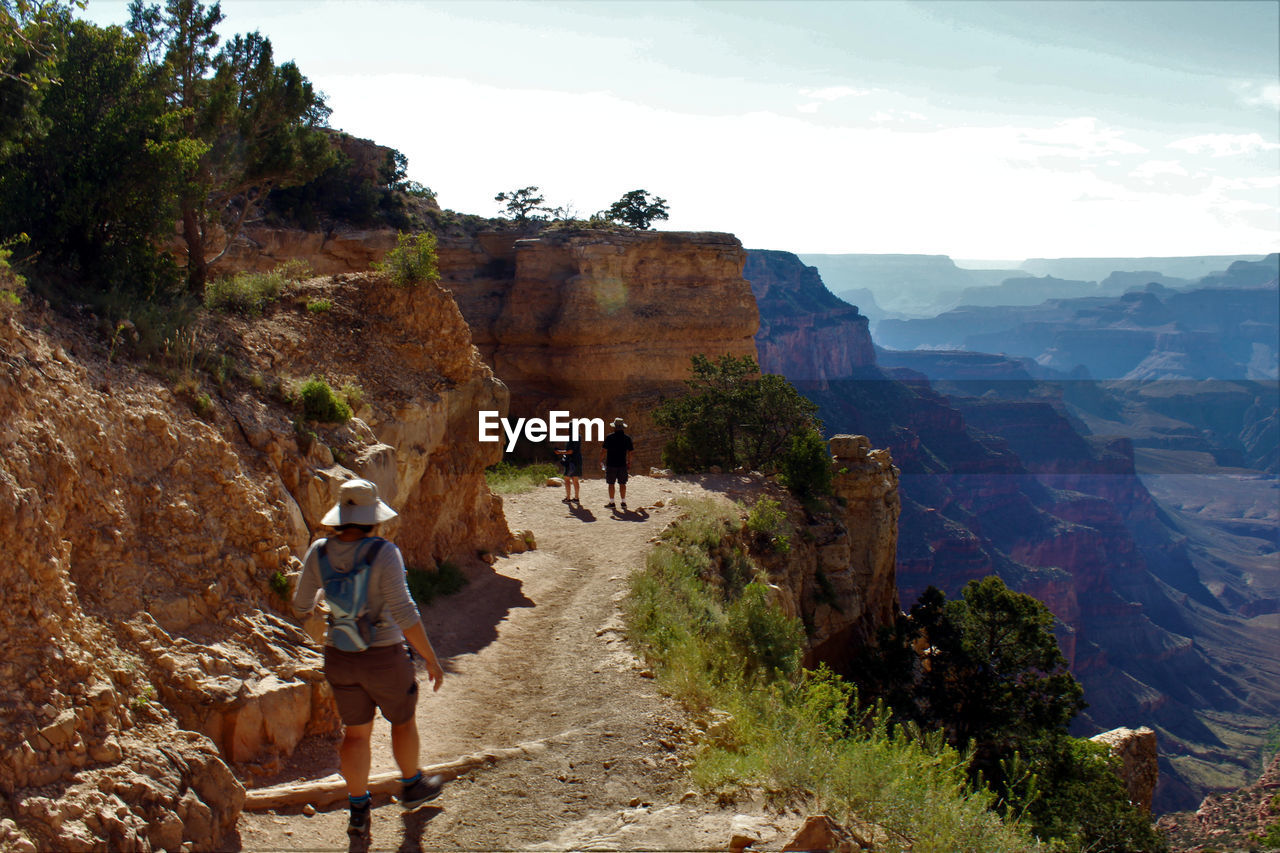 Rear view of people hiking on south kaibab trail at grand canyon
