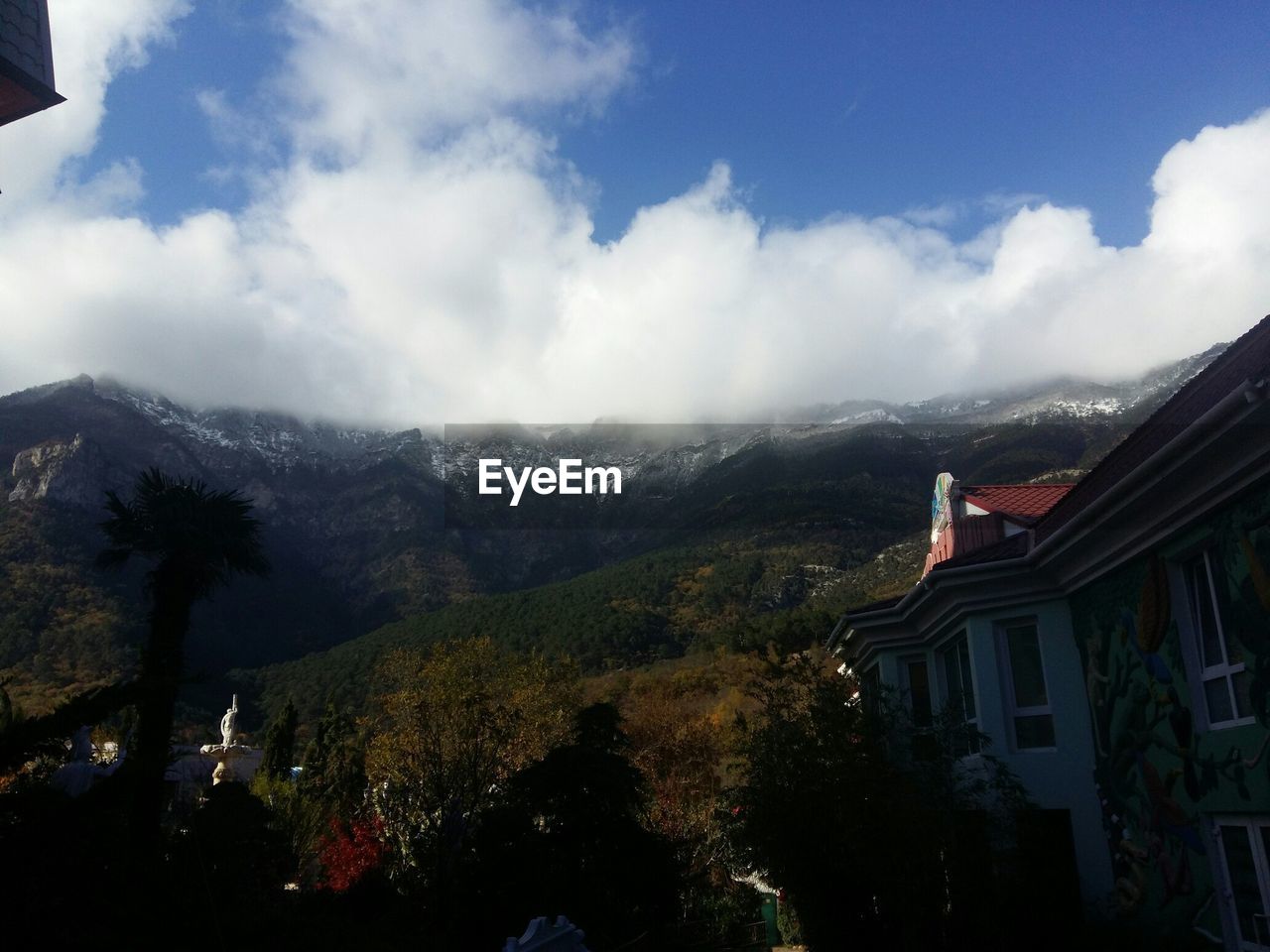 SCENIC VIEW OF MOUNTAIN AGAINST CLOUDY SKY