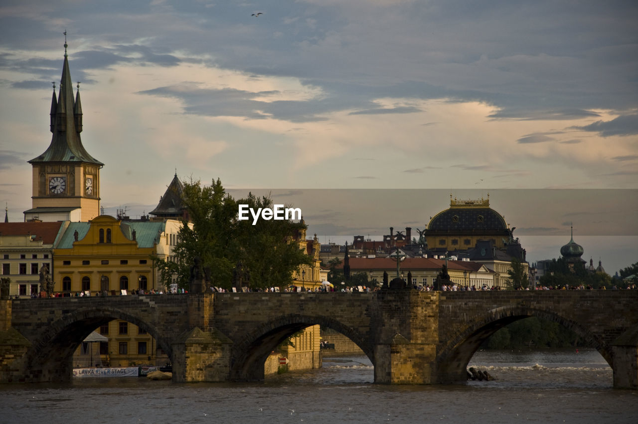 Arched bridge against built structures