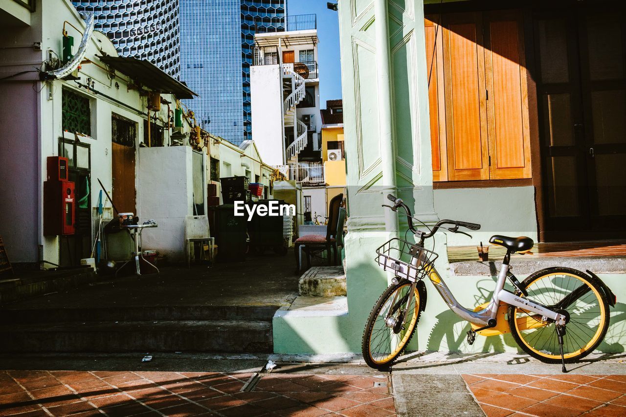 BICYCLE ON FOOTPATH BY BUILDING