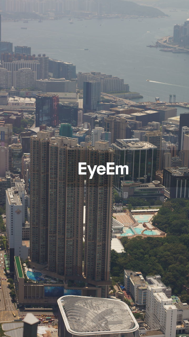 HIGH ANGLE VIEW OF BUILDINGS AND CITY IN BACKGROUND