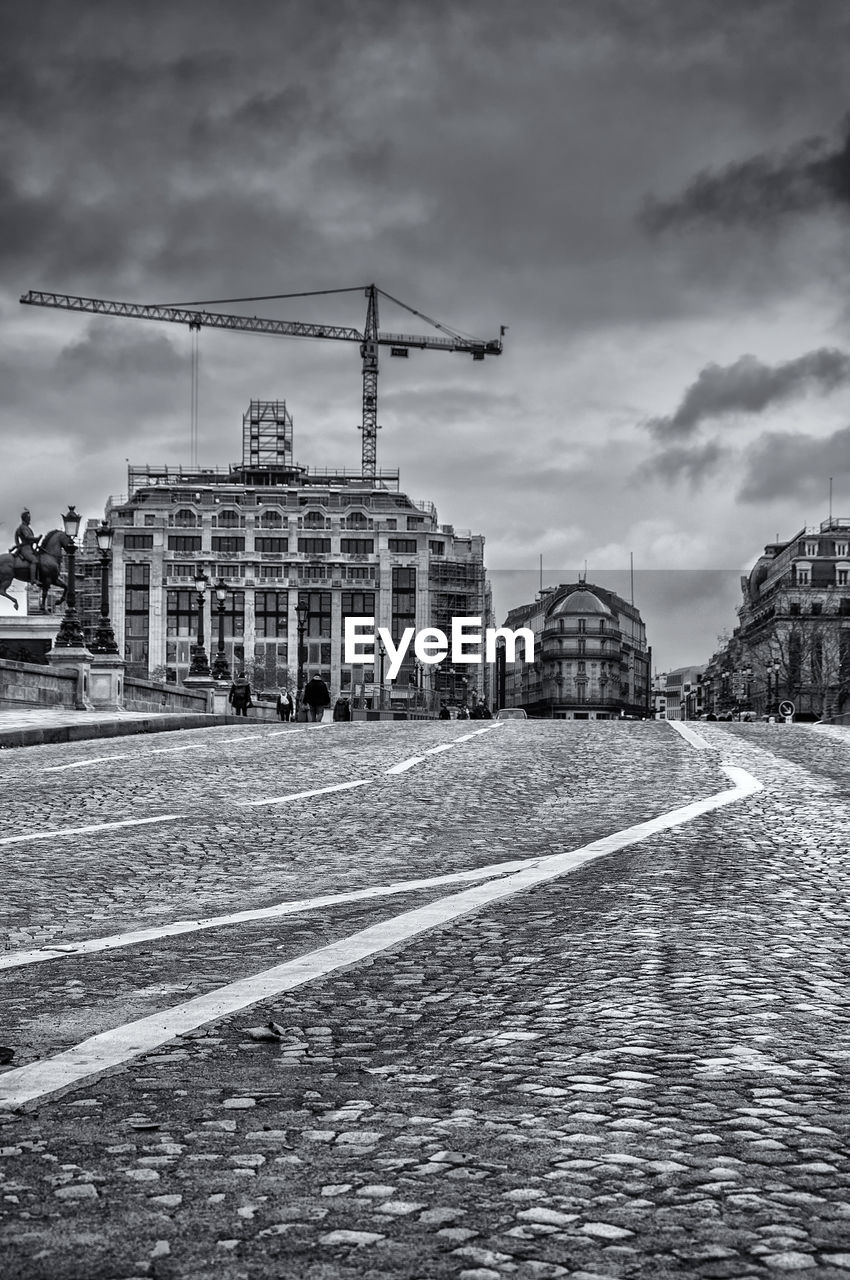 VIEW OF CONSTRUCTION SITE BY BUILDINGS IN CITY