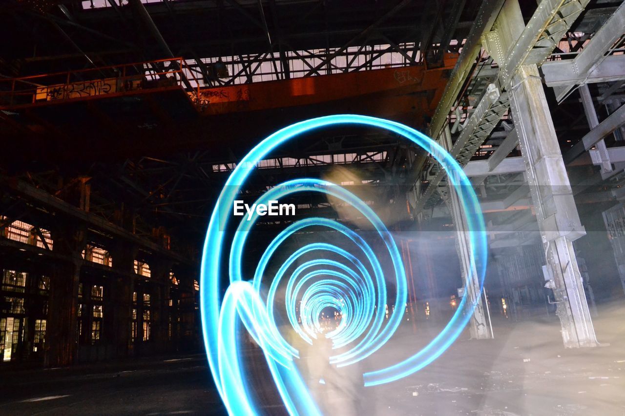 Spinning light painting in abandoned rail yard