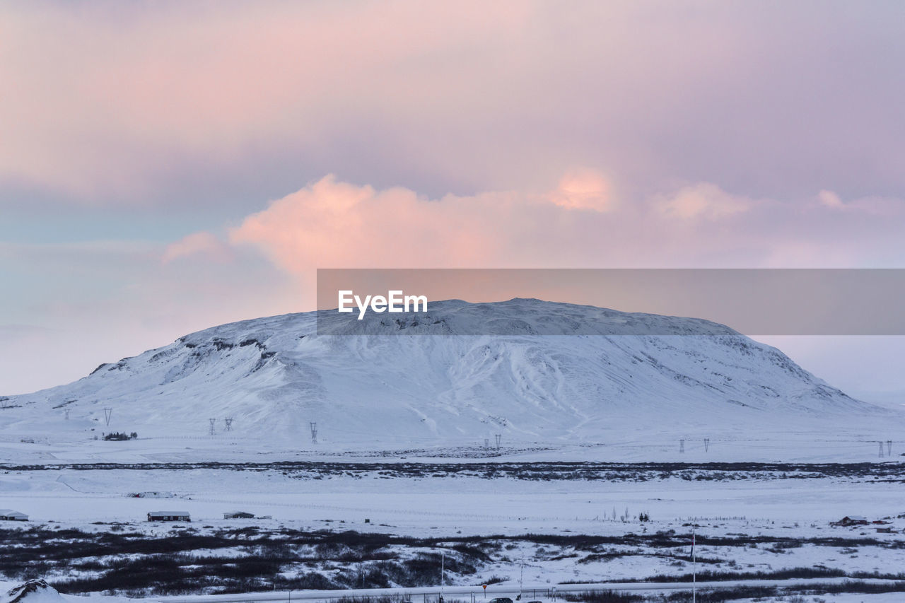 Scenic view of snowcapped mountains against sky during winter