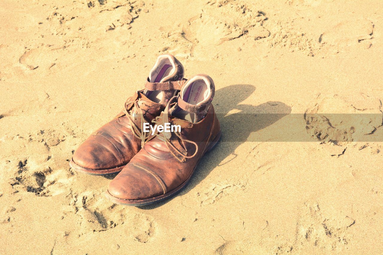 High angle view of shoes on sand