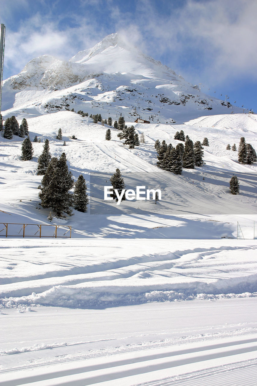 Scenic view of snowcapped mountain against sky