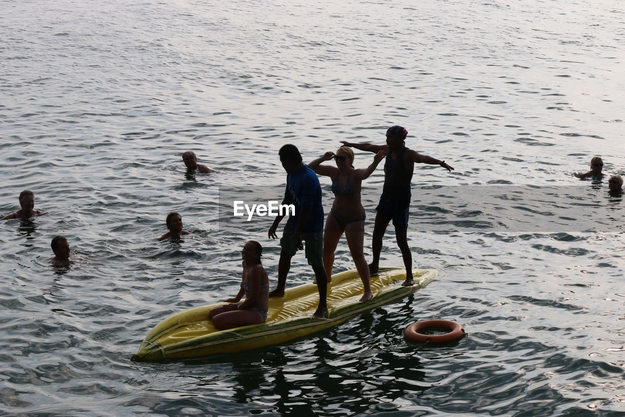 MEN AND PEOPLE ON WATER