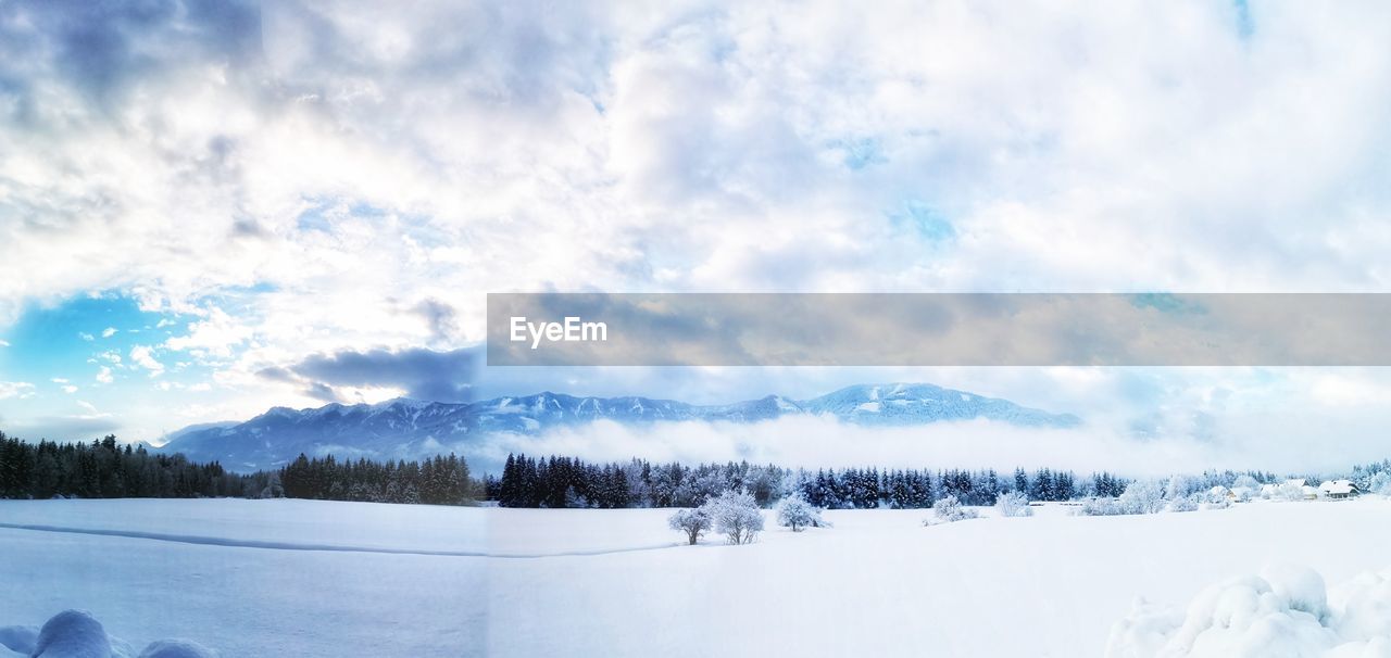 Scenic view of snowcapped landscape against sky