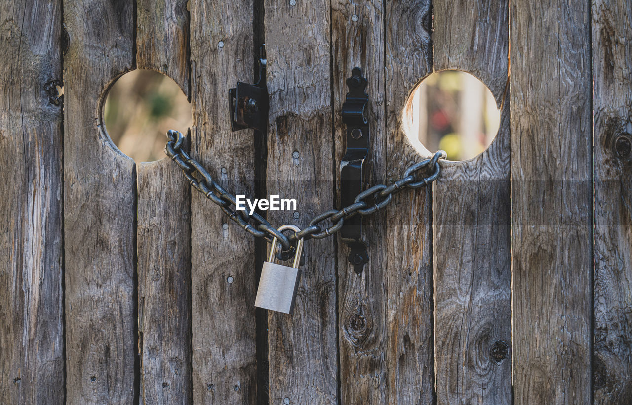 Old doors have been locked with a chain and padlock