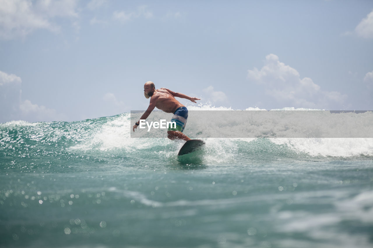 Man surfing on sea