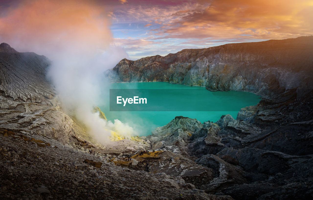 Smoke emitting from hot spring amidst mountains