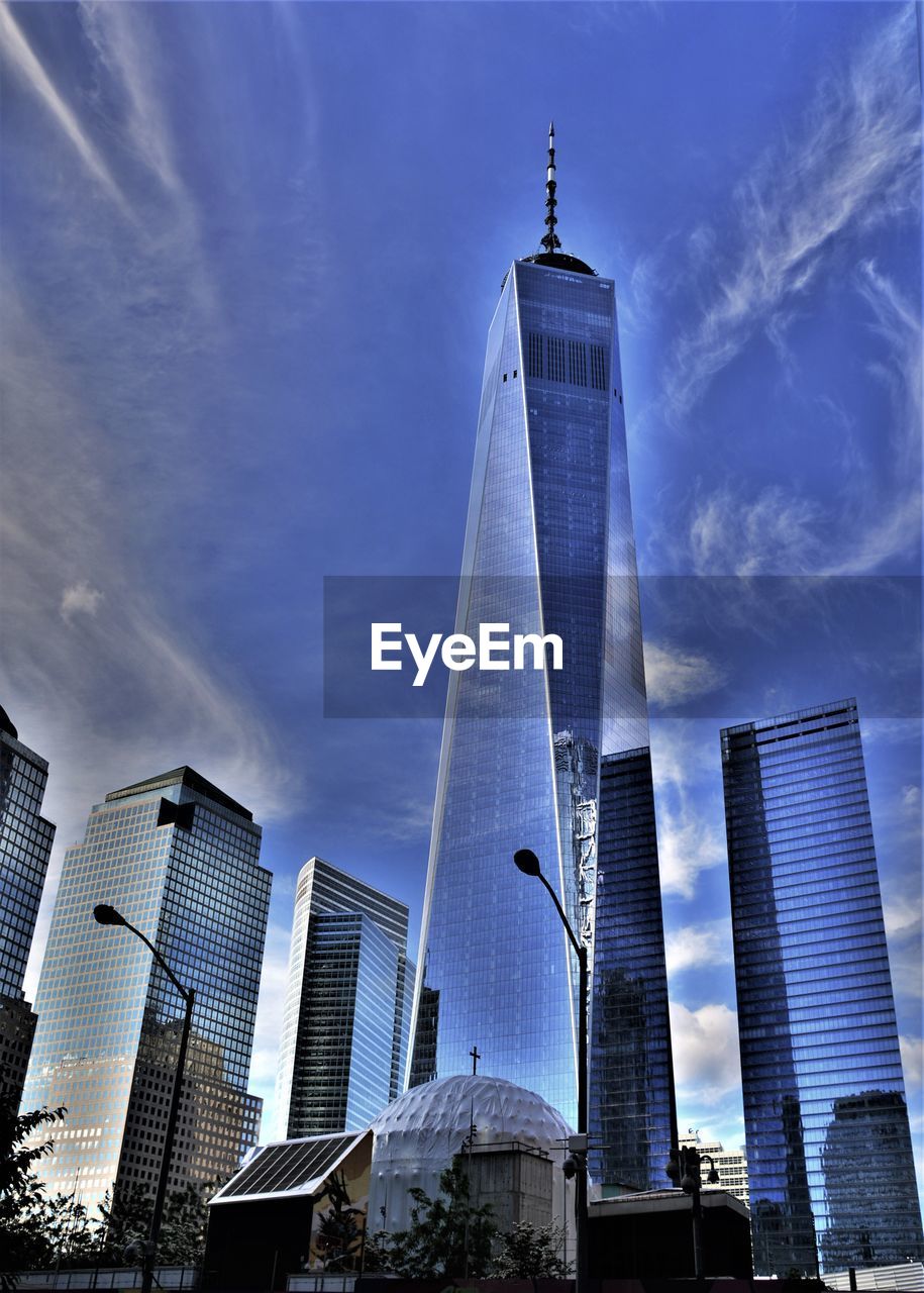 Low angle view of modern buildings in city against sky