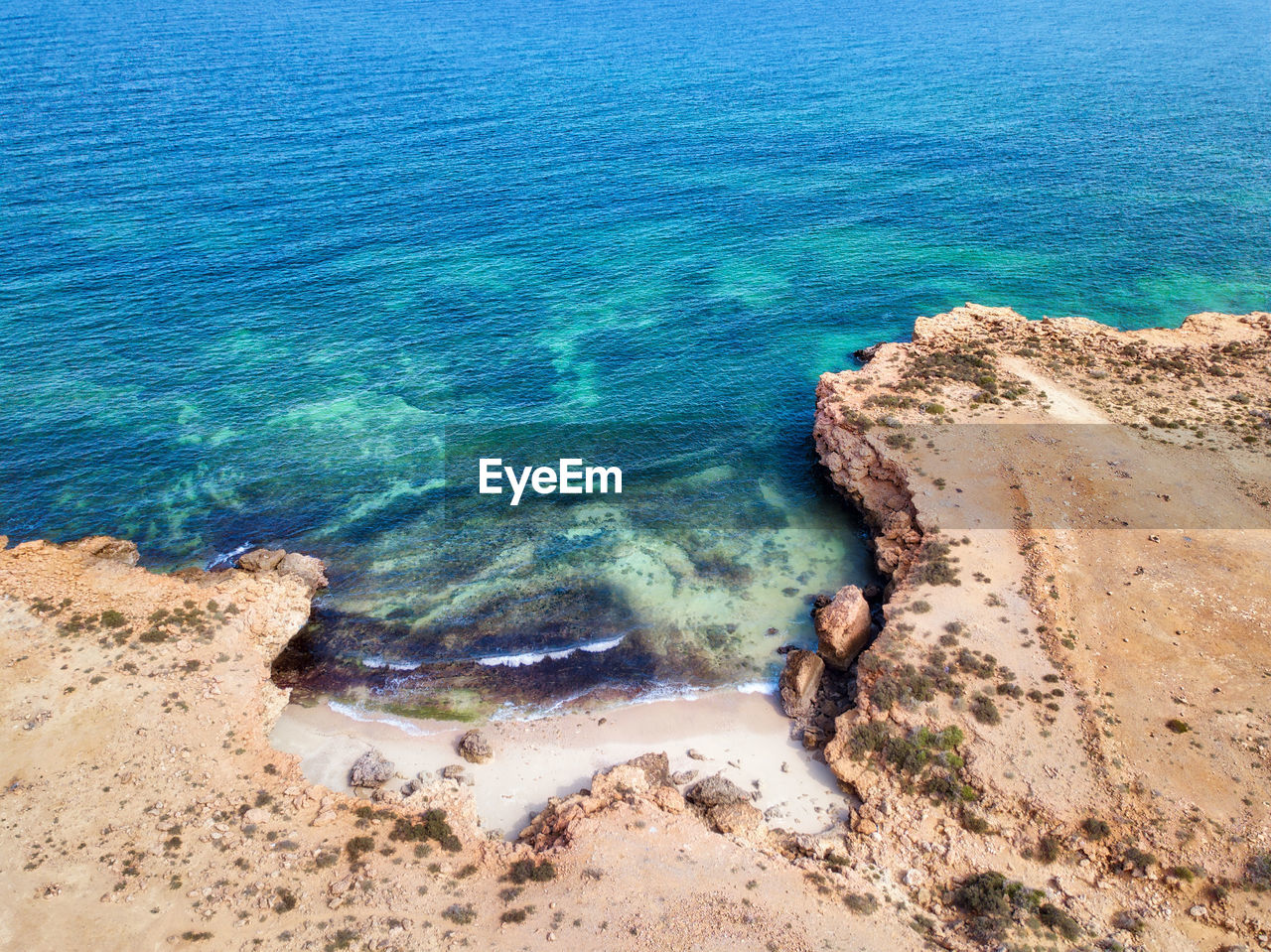 Blue water bay between rocks, oman taken in 2015