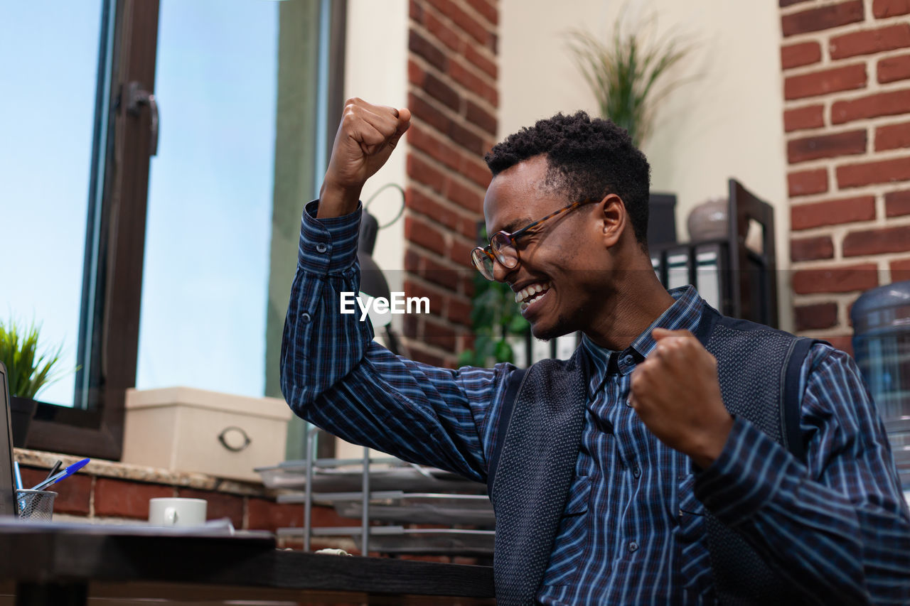 Cheerful businessman at office