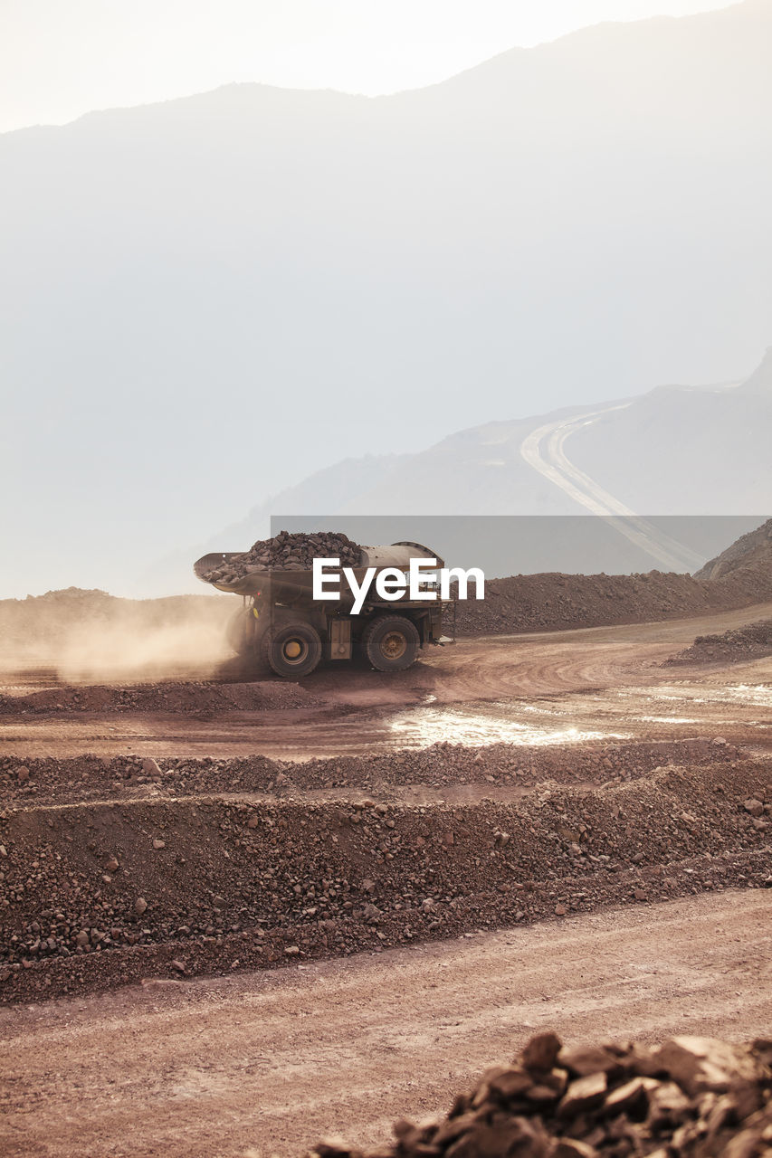 Mining activity, mining dump truck, high angle view of truck working on field