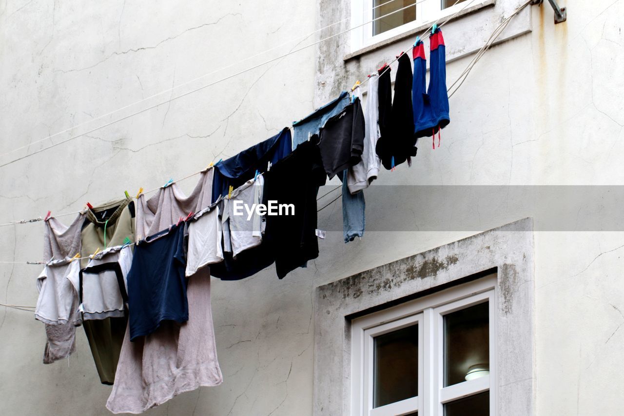 low angle view of clothes hanging on wall