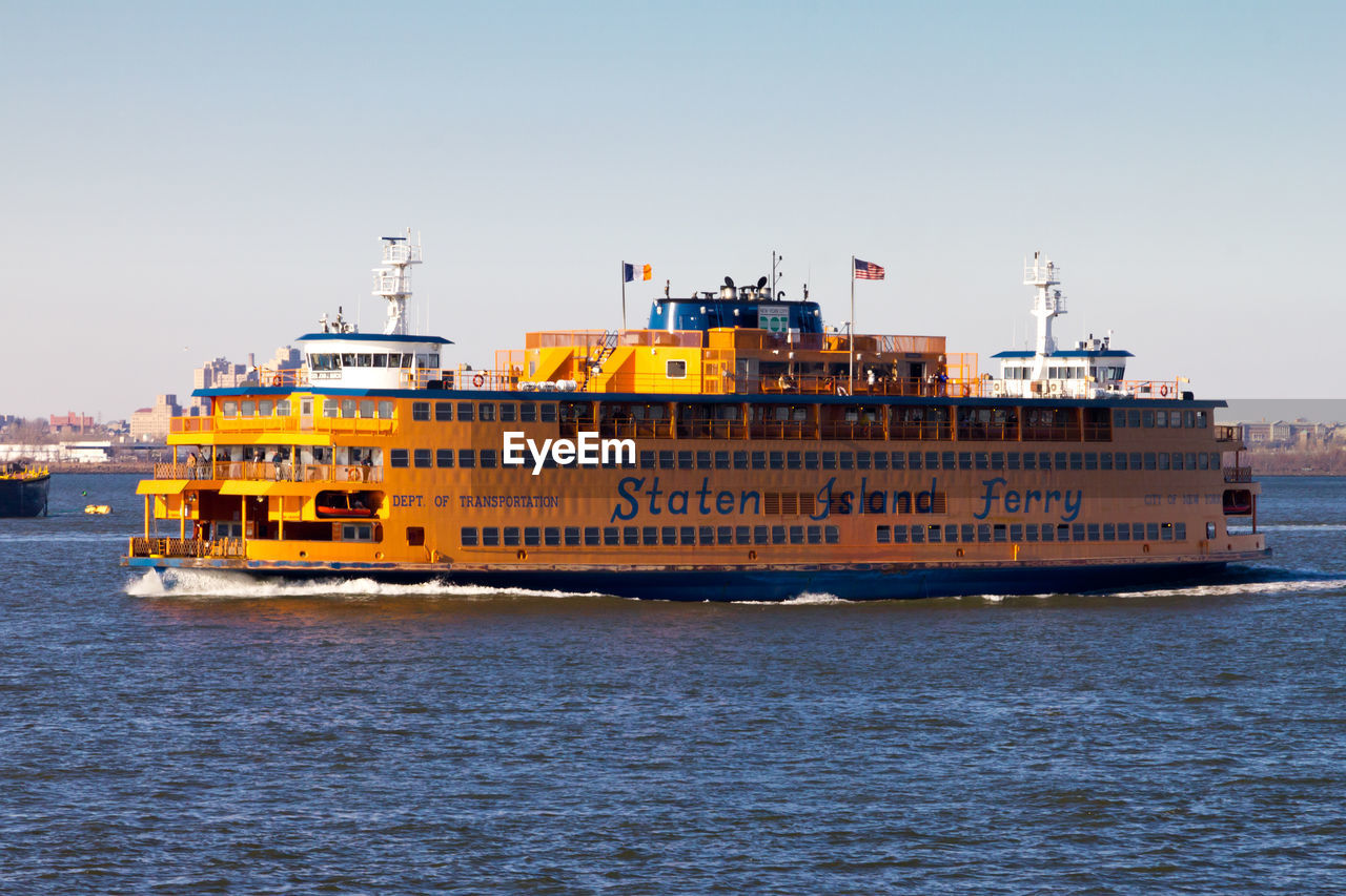 SHIP SAILING IN SEA AGAINST CLEAR SKY