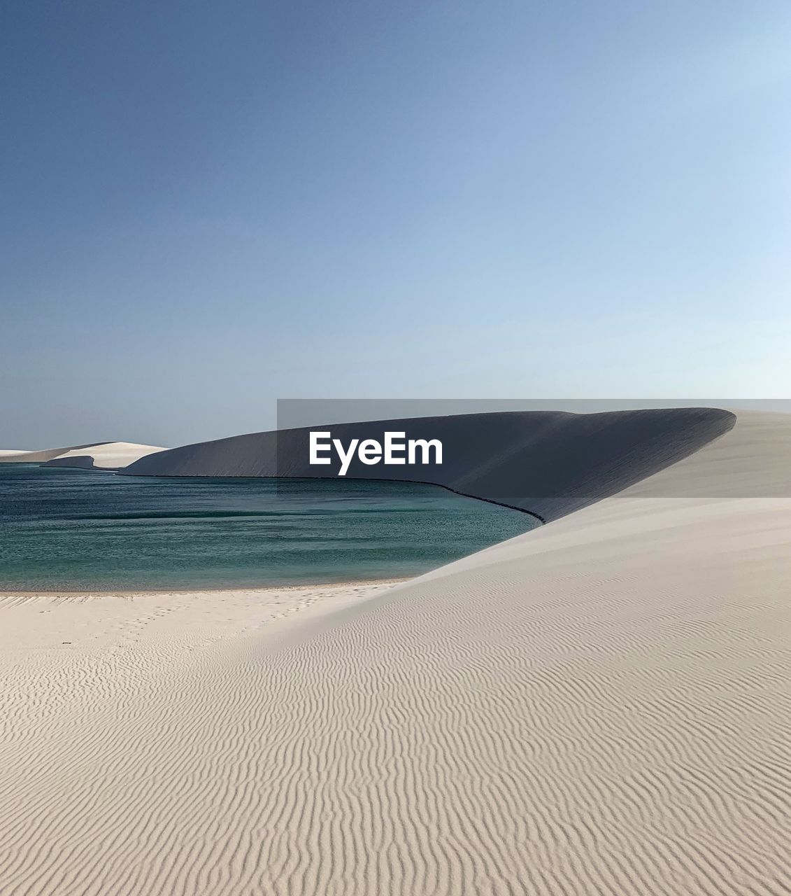 Scenic view of beach against clear sky