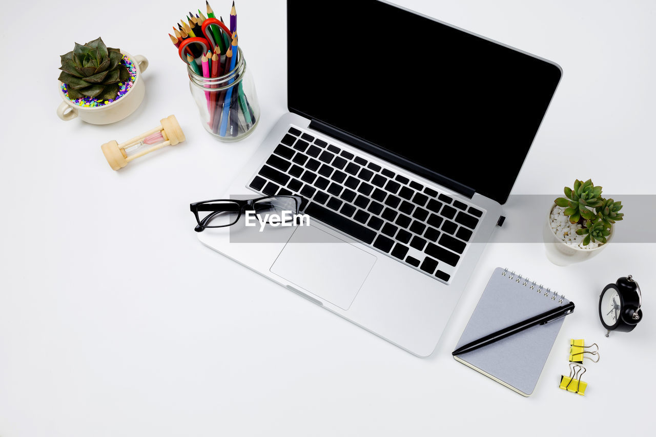 High angle view of laptop on white background