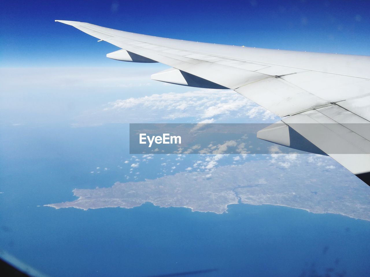 AERIAL VIEW OF CLOUDS OVER BLUE SKY