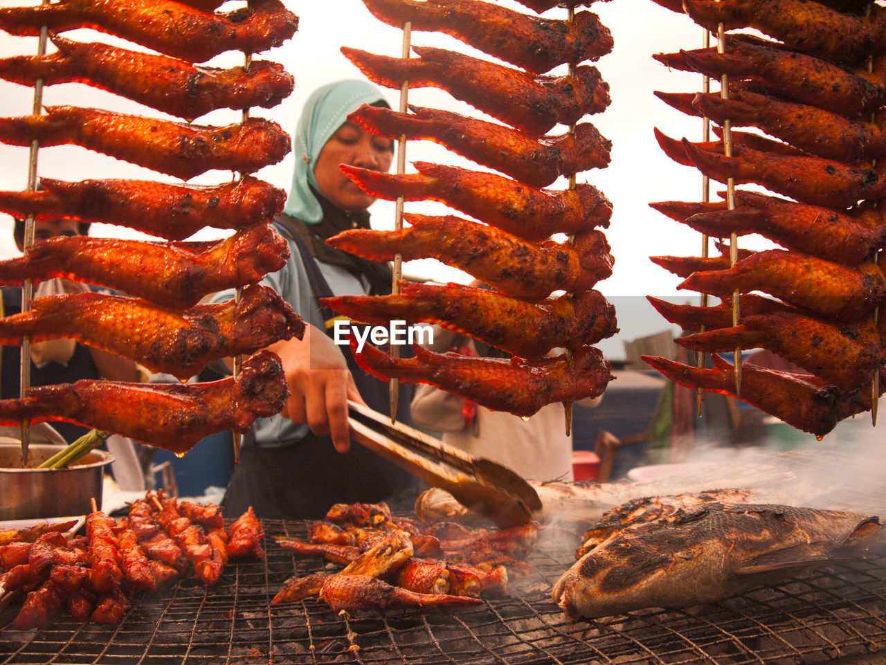 CLOSE-UP OF MEAT ON BARBECUE