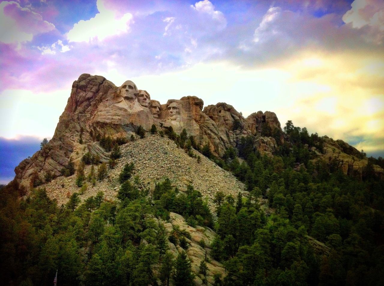 Low angle view of mount rushmore against clouds