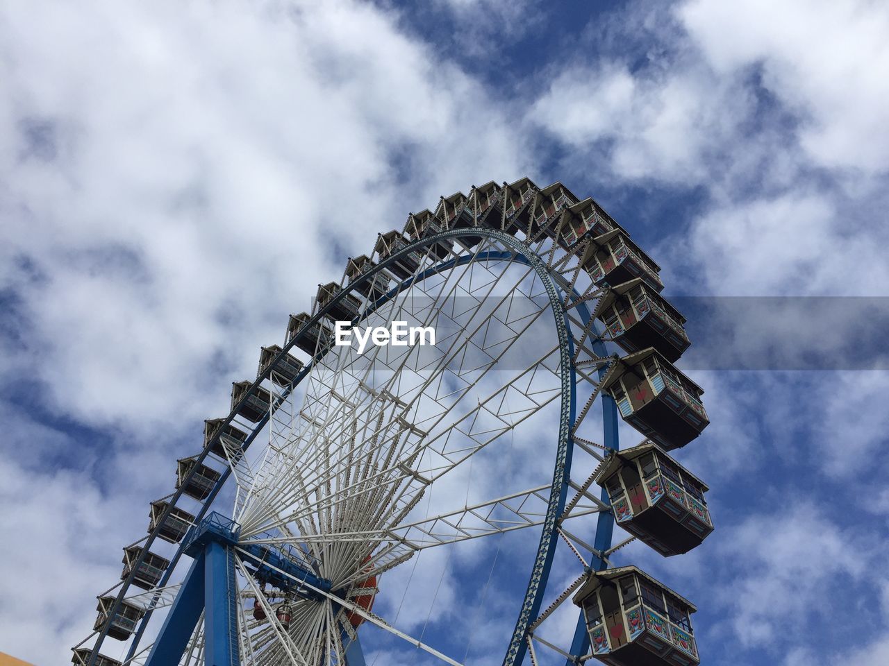 LOW ANGLE VIEW OF ROLLERCOASTER AGAINST SKY