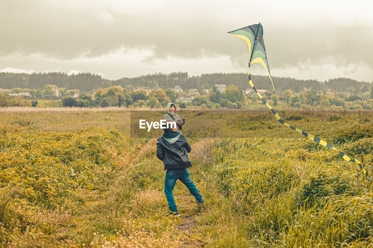 Man standing on land against sky