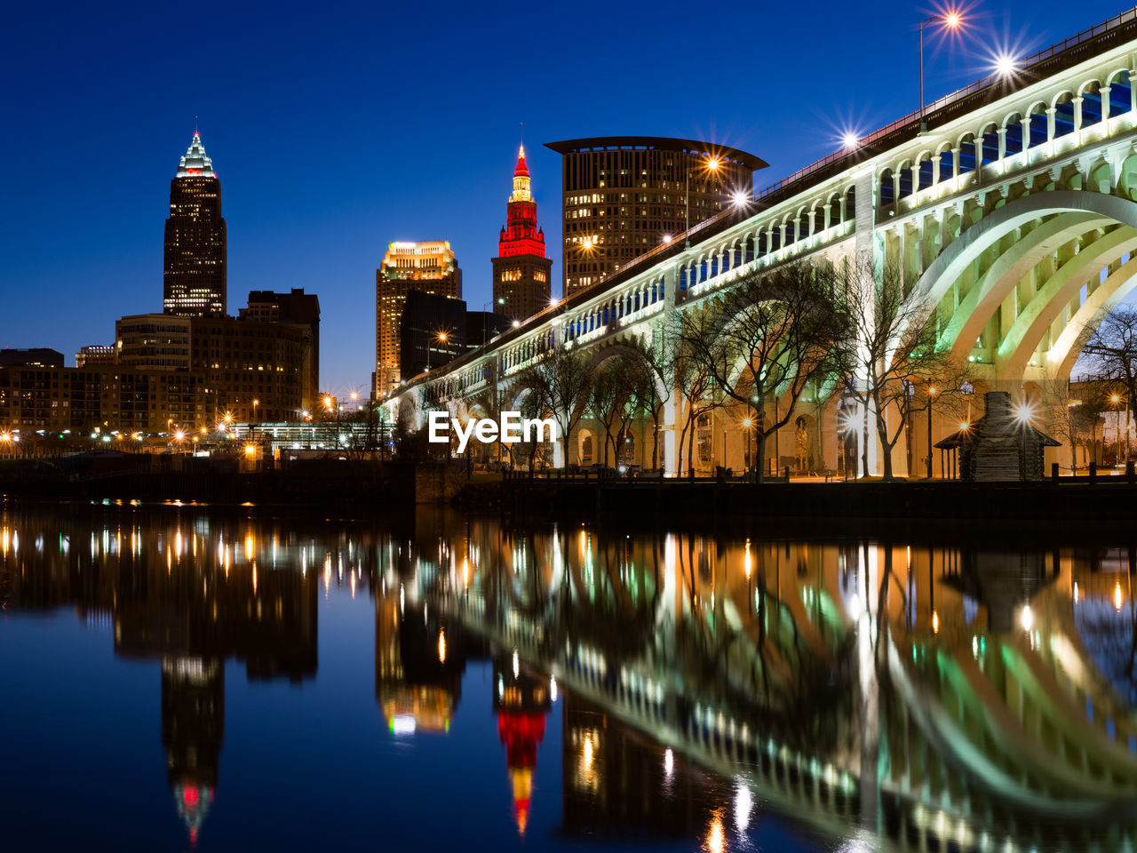 Reflection of illuminated buildings in water at night