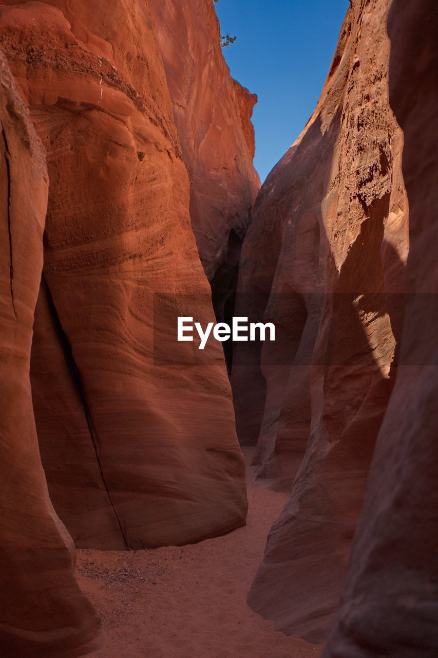 Low angle view of rock formation slot canyon 