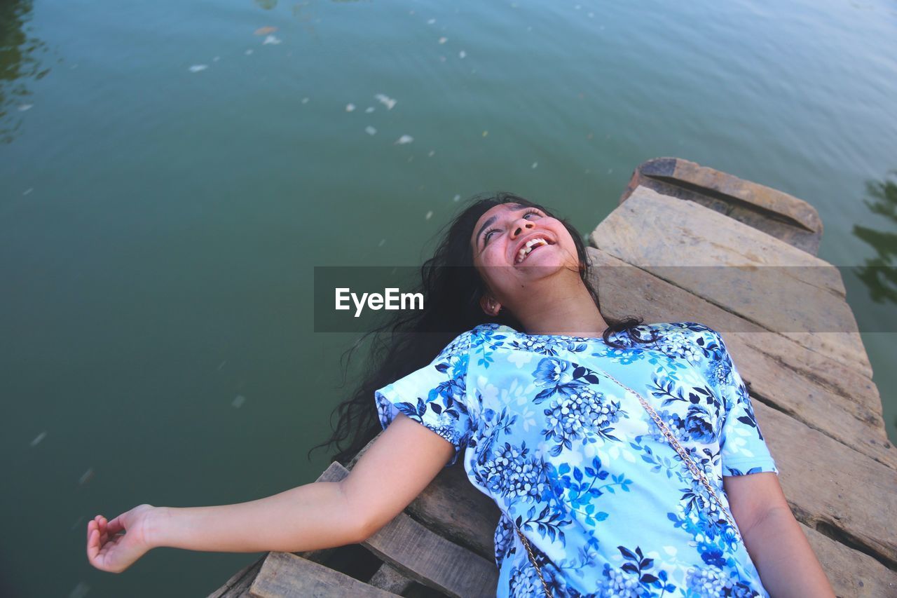 Portrait of young woman on pier