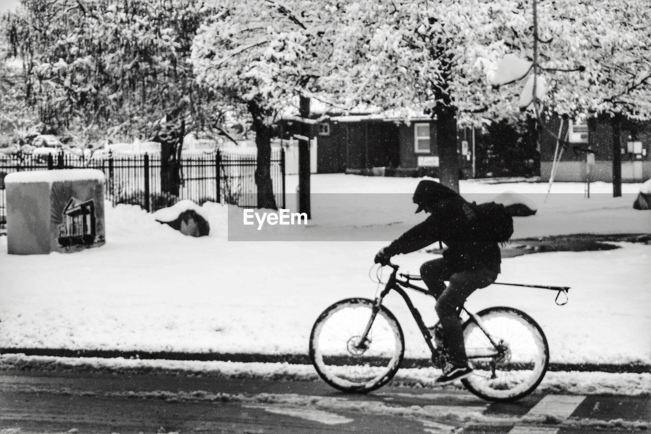 Bicycle parked on snow covered road