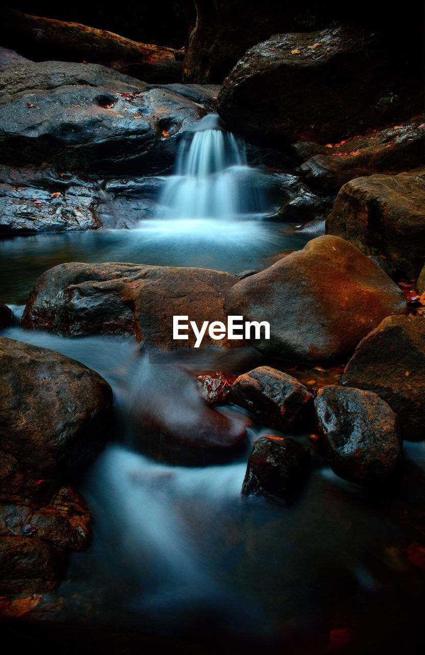 WATER FLOWING THROUGH ROCKS