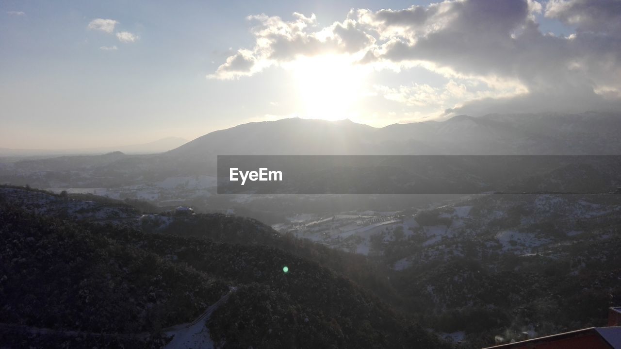 SCENIC VIEW OF LANDSCAPE AGAINST SKY DURING SUNSET