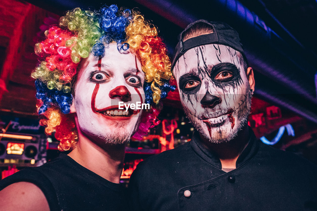 Portrait of smiling friends in halloween costume