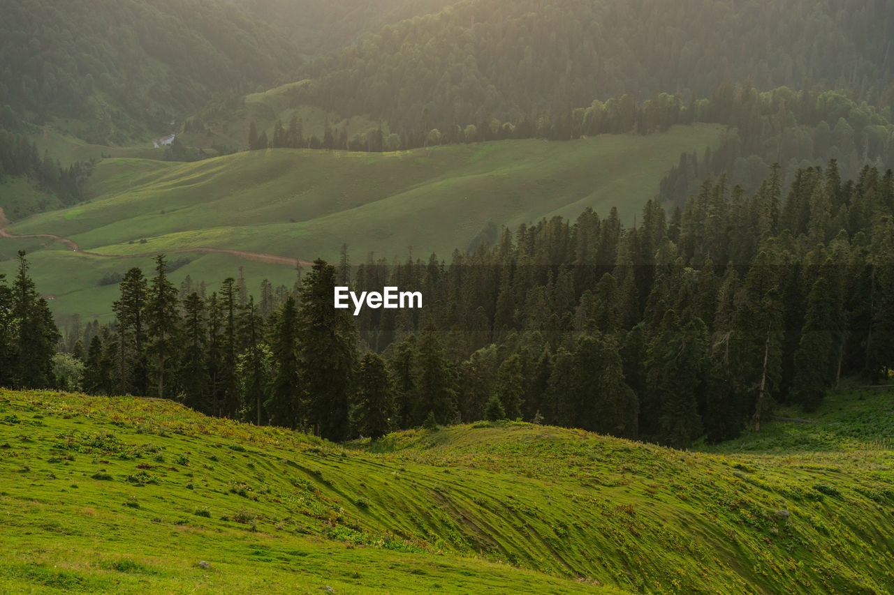 scenic view of mountains against sky during sunset