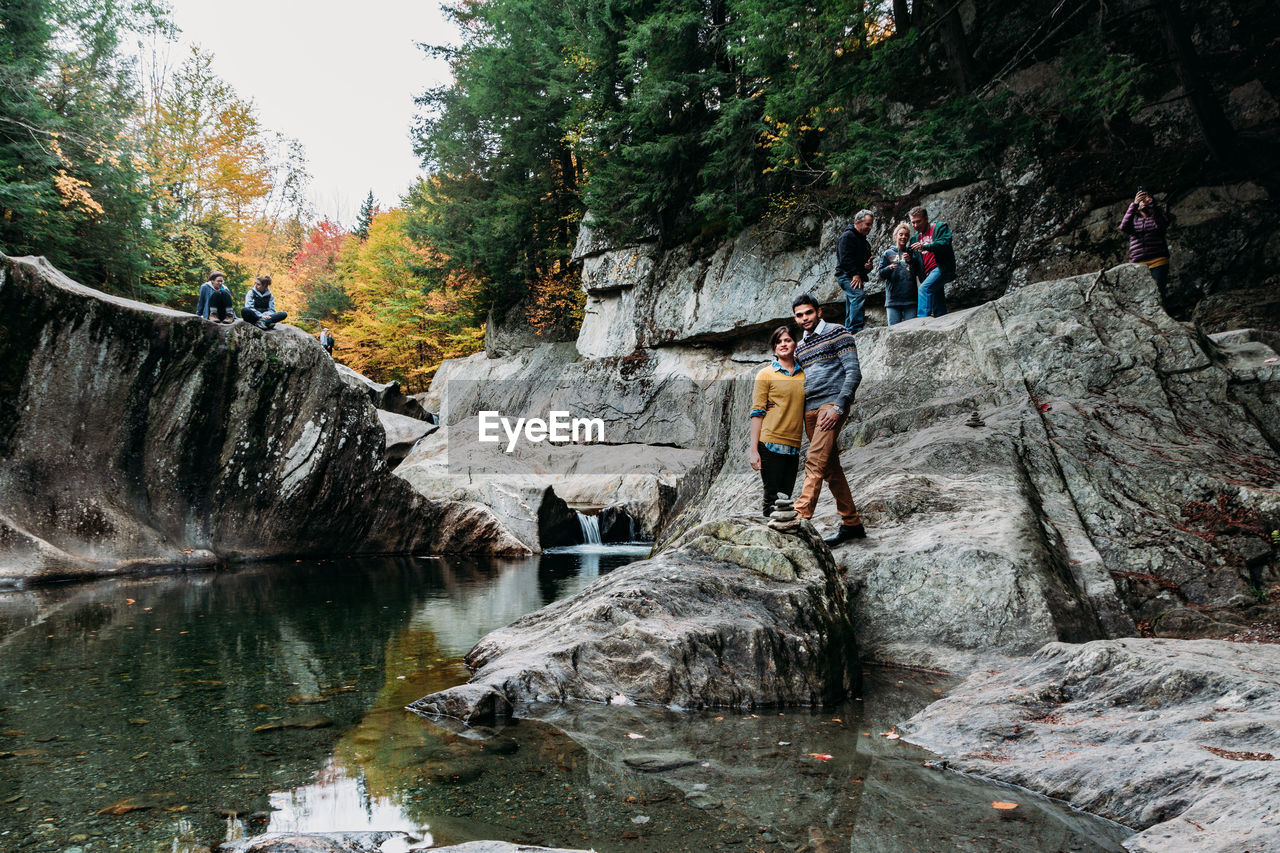 Group of tourists at waterfall