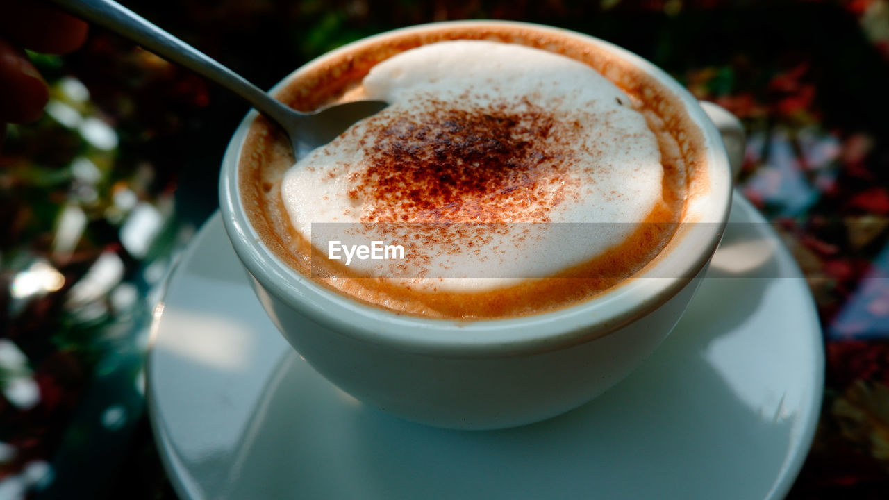 Close-up of coffee cup on table