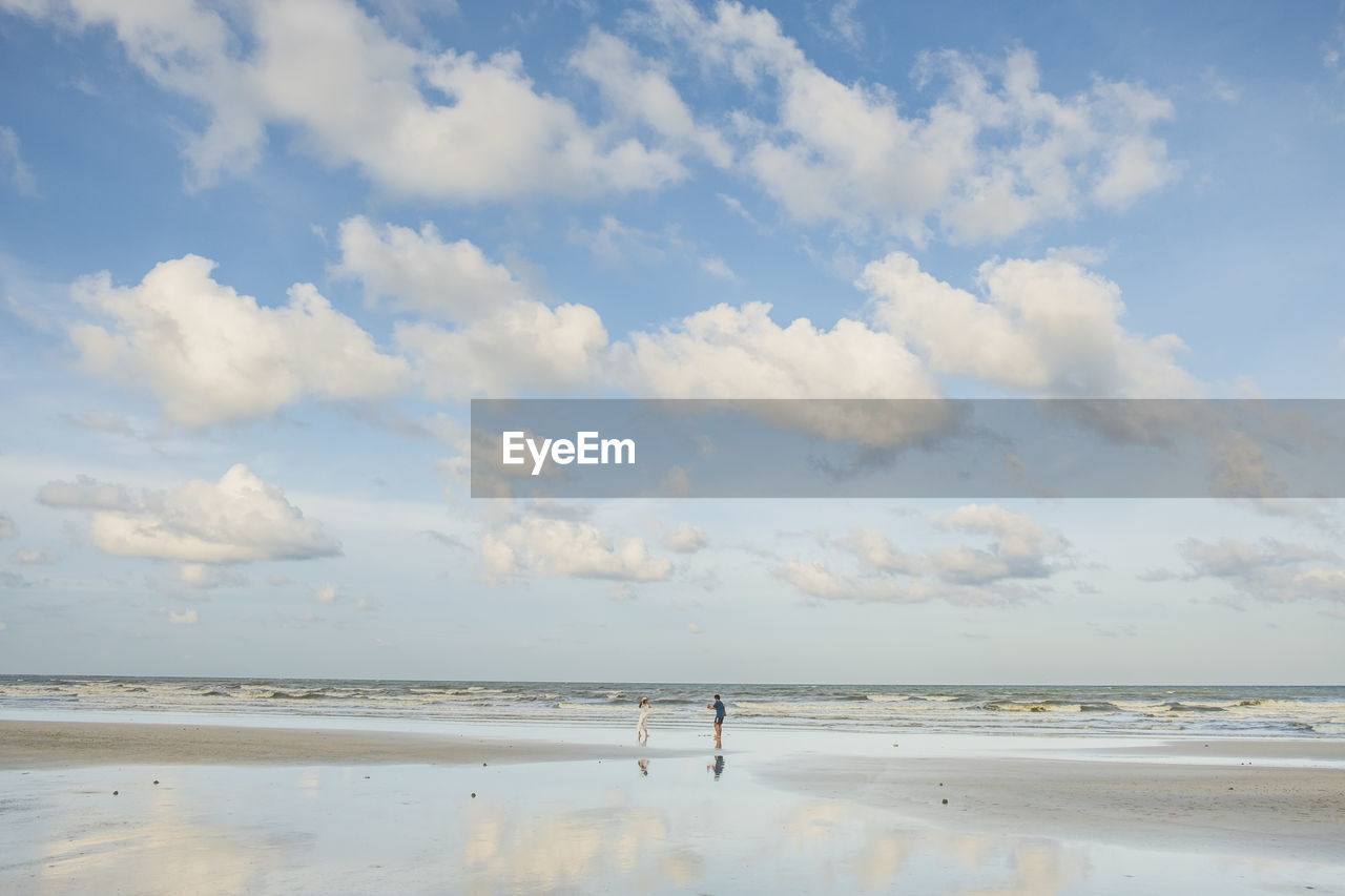 Couple standing at beach