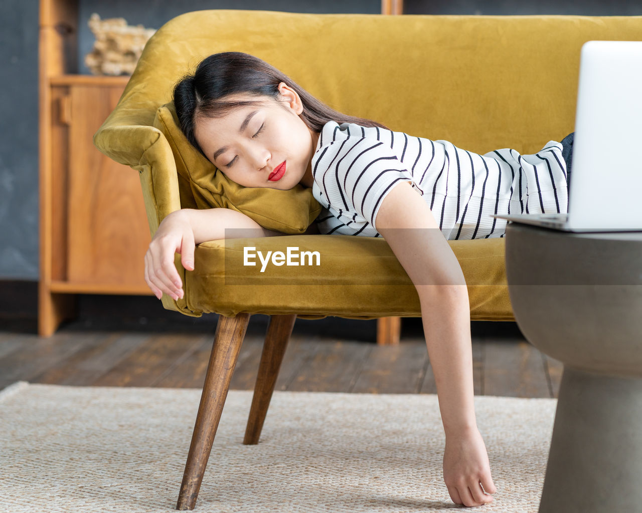 Full length of woman sitting on chair