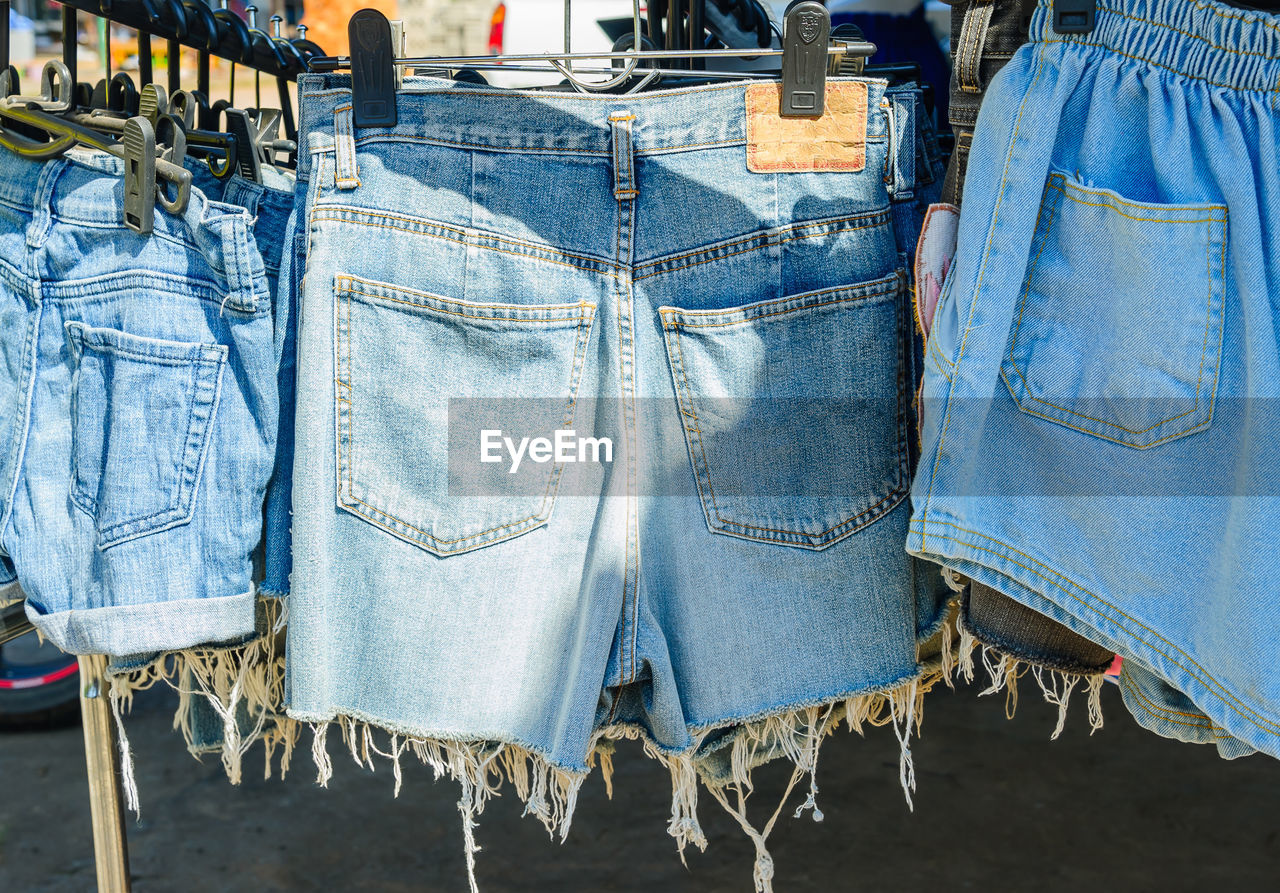 Close-up of hot pants hanging for sale in market