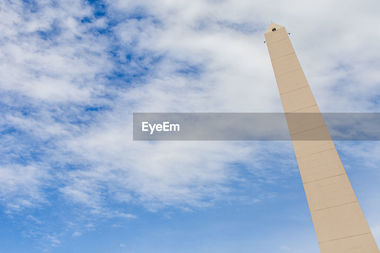 LOW ANGLE VIEW OF SMOKE STACK AGAINST CLOUDY SKY