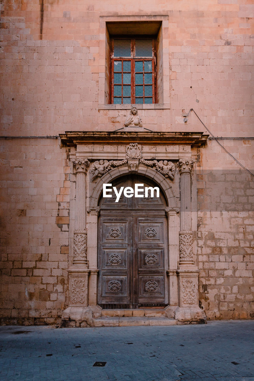 Characteristic gateway in the historic centre of ortigia, syracuse