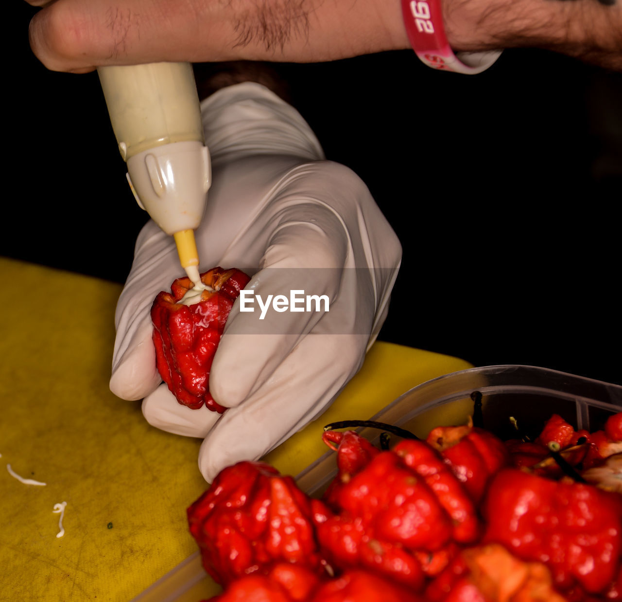 HIGH ANGLE VIEW OF WOMAN HOLDING STRAWBERRIES