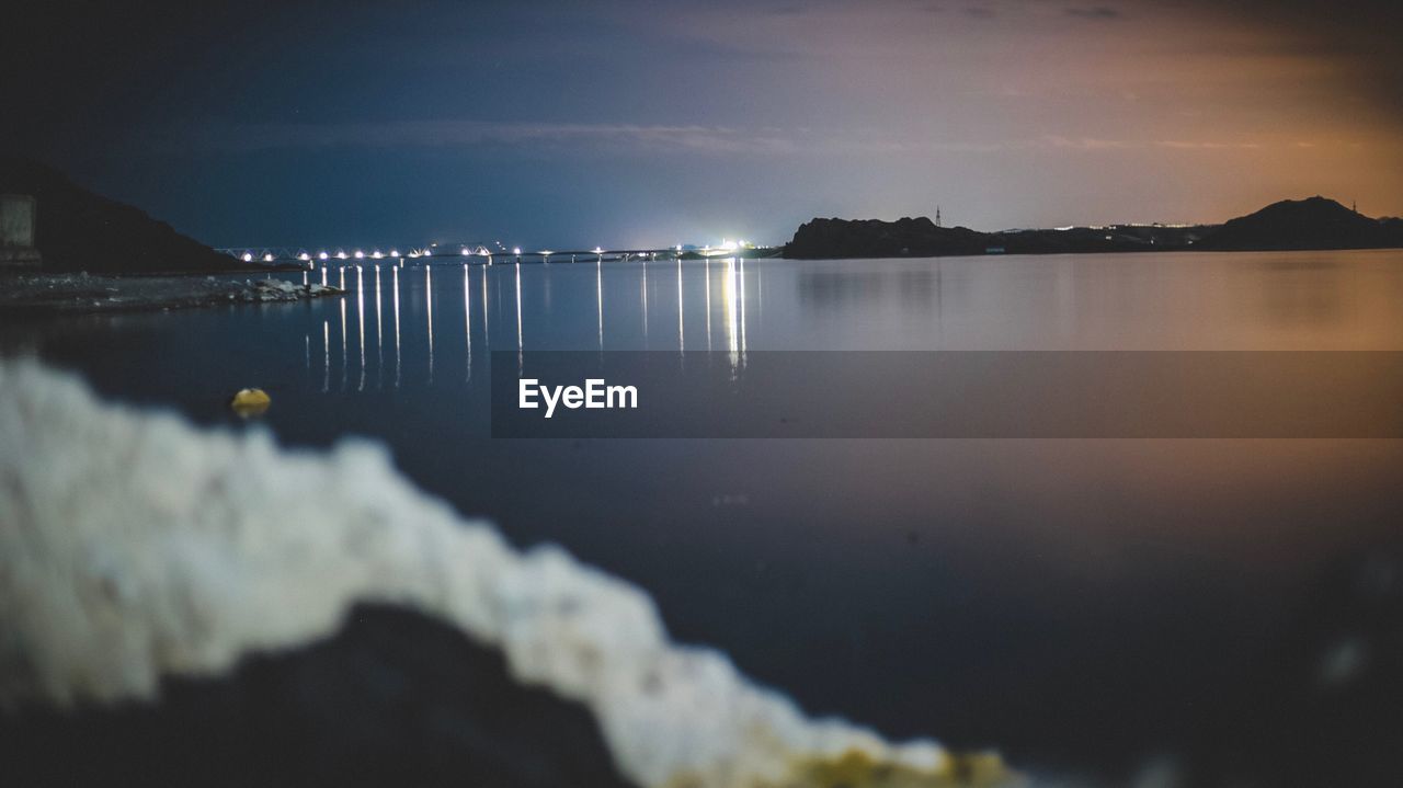 PANORAMIC VIEW OF SEA AGAINST SKY AT NIGHT