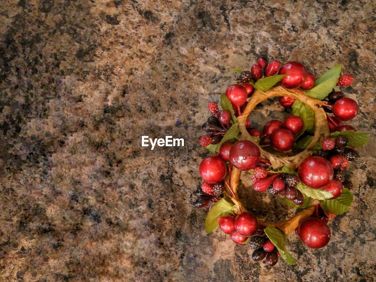 HIGH ANGLE VIEW OF RED BERRIES ON GROUND