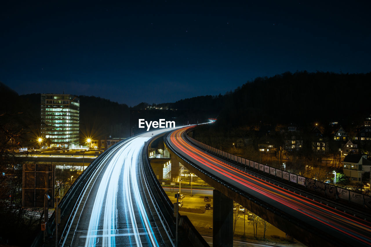 High angle view of light trails on highway at night