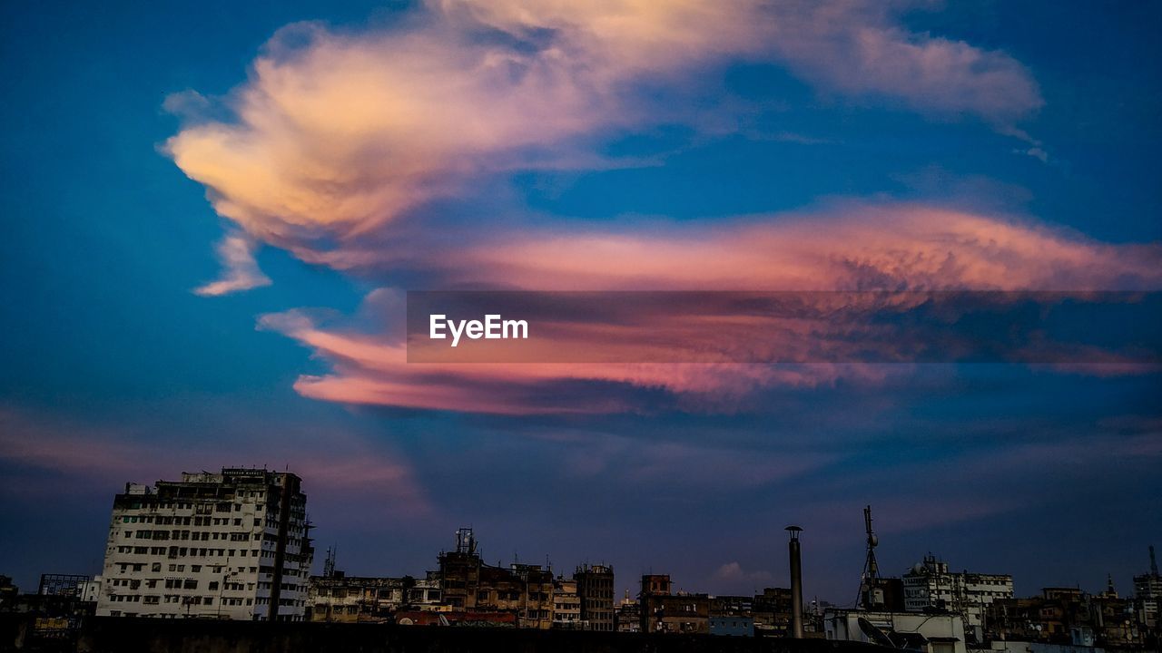 Panoramic view of buildings against sky during sunset