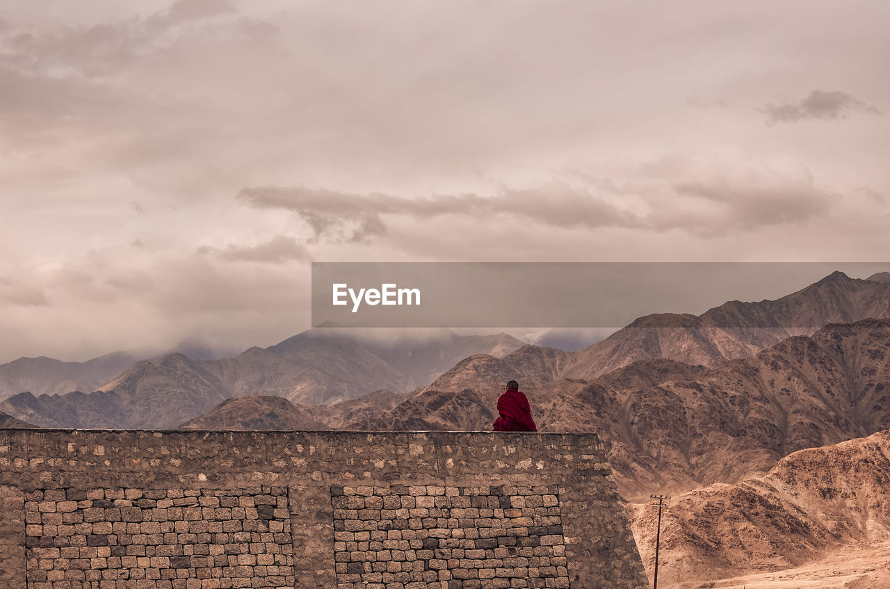 Scenic view of mountain against cloudy sky